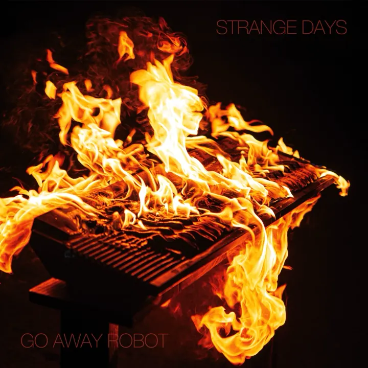 Strange Days artwork: a keyboard engulfed in flames
